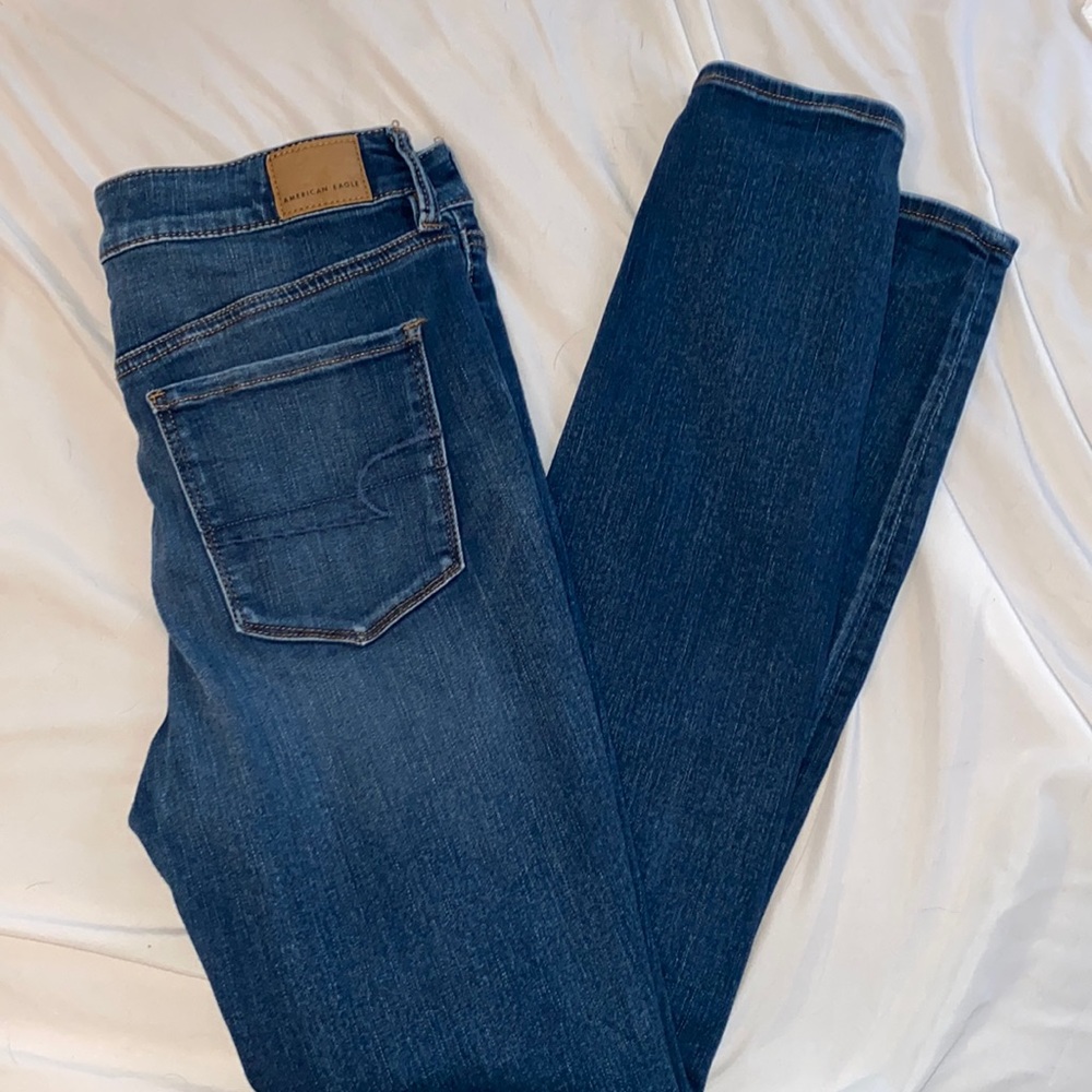 AE, hi-rise jeggings, dark wash with distressed knees and thighs, straight leg